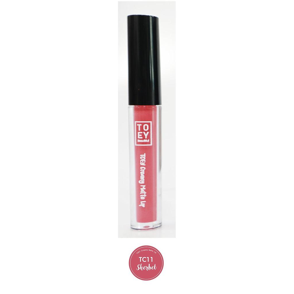 โตอี้ ครีมมี่ แมตต์ ลิป (TC11-Sherbet) ลิปสติกออร์แกนิค เนื้อครีมมี่ เม็ดสีชนิด Food Grade นำเข้าจาก U.S.A. เม็ดสีแน่น สีสวย ไม่แตก ไม่แห้ง ไม่ลอก อุดมไปด้วยสารสกัดจากธรรมชาติ  พร้อมผสานการบำรุงจาก Organic Rose Hip Oil, Sunflower Oil, Argan oil และ Vitamin E บำรุงริมฝีปากให้มีความชุ่มชื้นตลอดทั้งวัน ขนาดบรรจุ 2.5 g.
